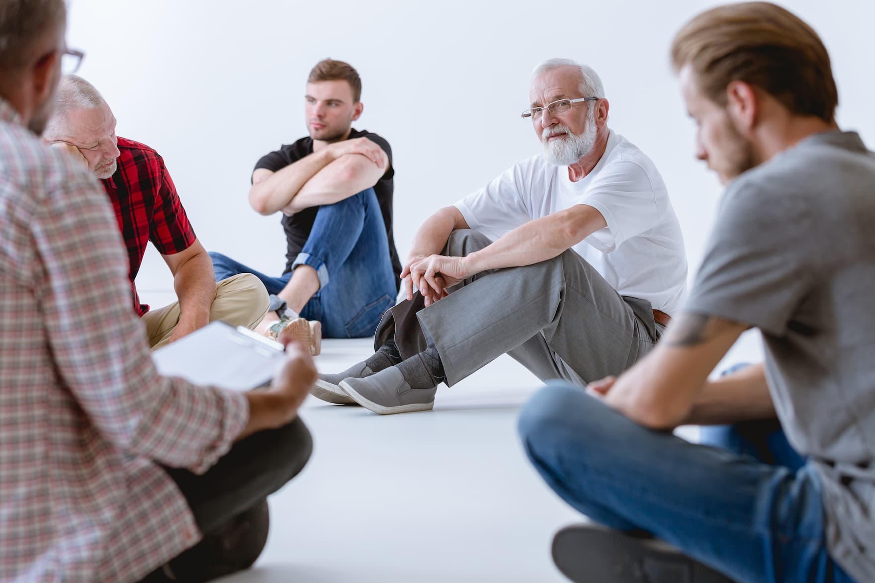men in a group therapy session for Physical Infidelity| Becoming Well Institute